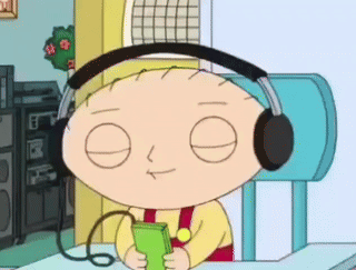 A Cartoon Character Wearing Headphones Is Holding A Cell Phone GIF