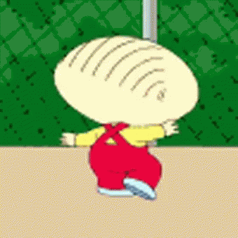 A Cartoon Character With A Bald Head And Red Pants Is Standing On A Sidewalk . GIF
