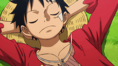 A Cartoon Character With A Bandage On His Face Is Laying On The Grass With His Eyes Closed GIF