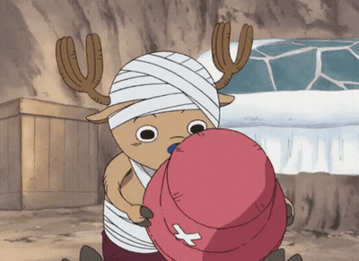 A Cartoon Character With A Bandage On His Head Holding A Pink Hat With A Cross On It GIF
