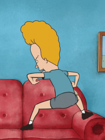 A Cartoon Character With A Big Head Is Squatting Down On A Red Couch GIF