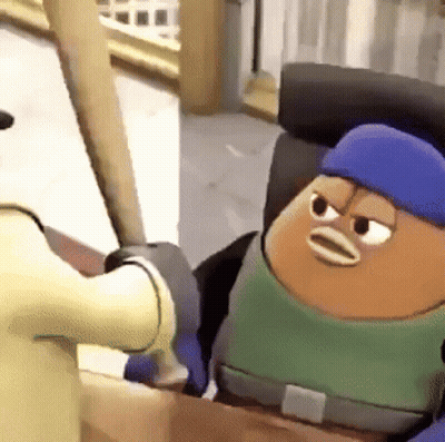A Cartoon Character With A Blue Hat And A Green Shirt Is Sitting In A Box . GIF