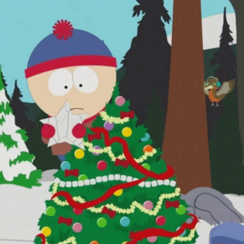 A Cartoon Character With A Christmas Tree In The Background GIF