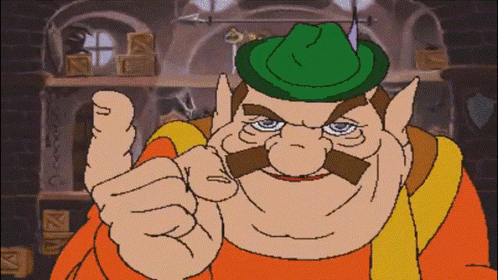 A Cartoon Character With A Green Hat And A Mustache Points At The Camera GIF