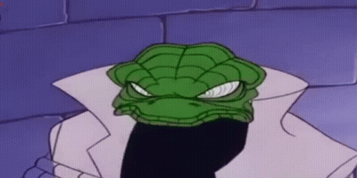 A Cartoon Character With A Green Snake Head And A White Coat Is Standing In Front Of A Brick Wall . GIF