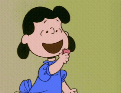 A Cartoon Character With A Heart In Her Hand GIF