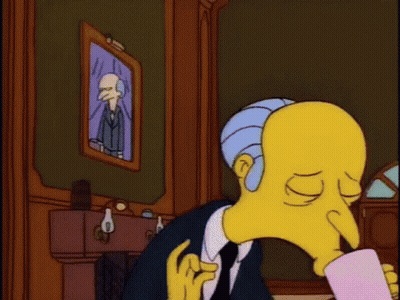 A Cartoon Character With A Long Nose Is Holding A Cup Of Coffee GIF