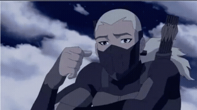 A Cartoon Character With A Mask On His Face Is Pointing At The Camera . GIF