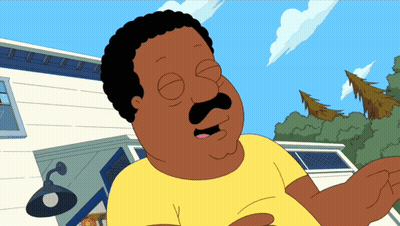 A Cartoon Character With A Mustache And A Yellow Shirt Is Standing In Front Of A House GIF