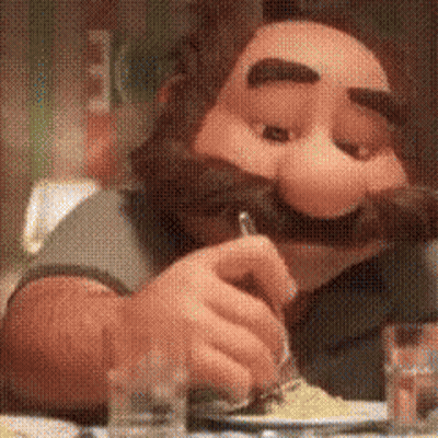 A Cartoon Character With A Mustache And Beard Is Sitting At A Table Eating Food . GIF