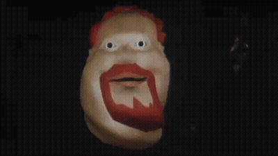 A Cartoon Character With A Red Beard Is Smiling And Says Hiya Slugger In The Dark . GIF