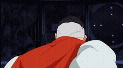A Cartoon Character With A Red Cape And A White Head GIF