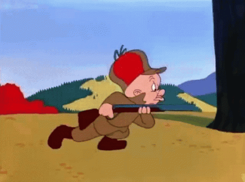 A Cartoon Character With A Red Hat Is Running With A Gun GIF