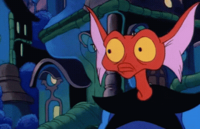 A Cartoon Character With A Red Head And Yellow Eyes Stands In Front Of A Building GIF