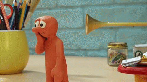 A Cartoon Character With A Sad Look On His Face Stands Next To A Trumpet GIF