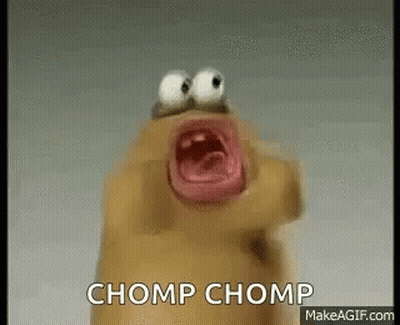 A Cartoon Character With Big Eyes Is Screaming With The Words Chomp Chomp Written On The Bottom . GIF