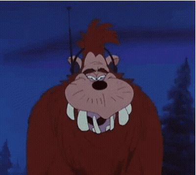 A Cartoon Character With Big Teeth And Headphones On GIF