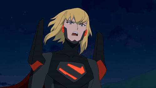 A Cartoon Character With Blonde Hair And A Red Cape Is Pointing Her Fist At The Camera GIF