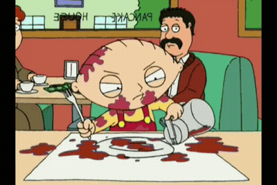 A Cartoon Character With Blood On His Face Is Sitting At A Table With A Plate Of Food On It GIF