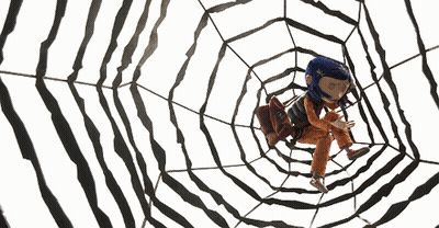 A Cartoon Character With Blue Hair Is Sitting In A Web GIF
