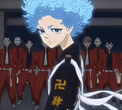 A Cartoon Character With Blue Hair Is Standing In Front Of A Group Of People GIF