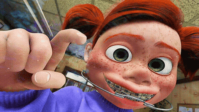 A Cartoon Character With Braces On Her Teeth Is Pointing GIF