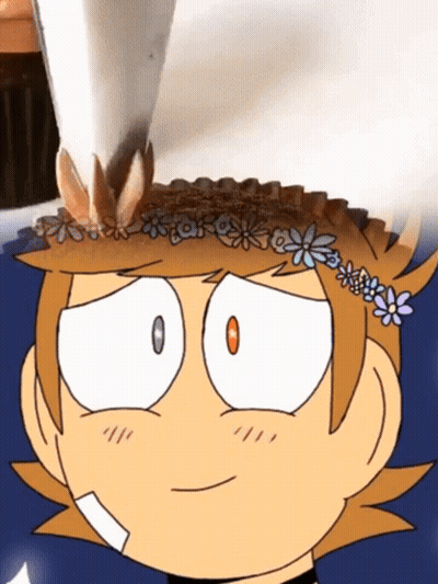 A Cartoon Character With Flowers On His Head GIF