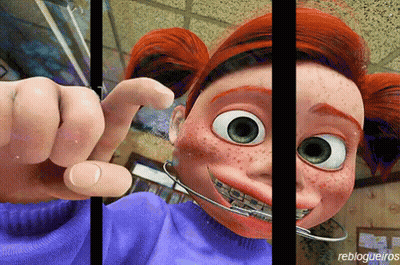 A Cartoon Character With Freckles And Braces On Her Teeth Is Behind Bars GIF