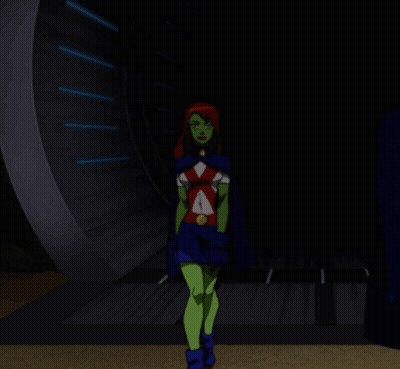 A Cartoon Character With Green Arms And Red Hair Stands With Her Arms Crossed GIF