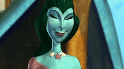 A Cartoon Character With Green Hair And A Blue Body Is Smiling . GIF
