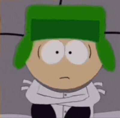 A Cartoon Character With Green Hair And A Green Hat Is Sitting With His Arms Crossed . GIF