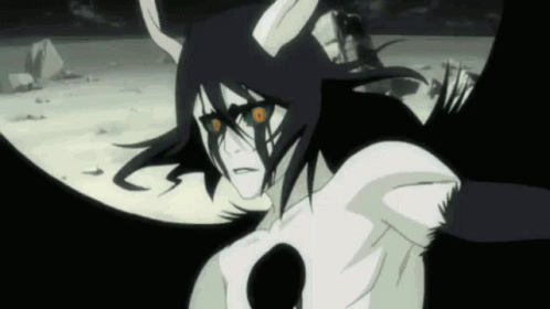 A Cartoon Character With Horns And Red Eyes Is Standing In The Dark . GIF