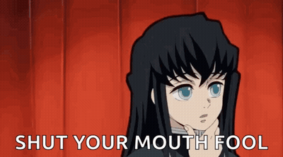 A Cartoon Character With Long Black Hair Is Holding His Hand To His Chin And Saying `` Shut Your Mouth Fool '' . GIF