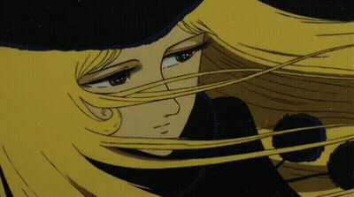 A Cartoon Character With Long Blonde Hair And A Black Hat GIF