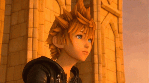 A Cartoon Character With Orange Hair And Blue Eyes Stands In Front Of A Building GIF