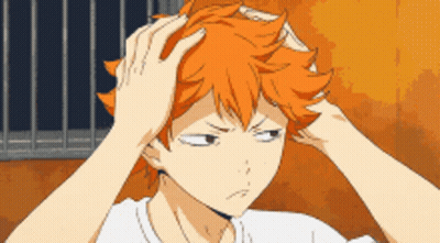 A Cartoon Character With Orange Hair Is Holding His Head GIF