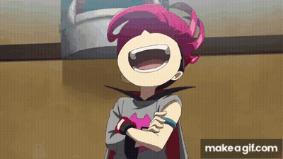 A Cartoon Character With Pink Hair And A Cape Is Laughing . GIF