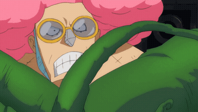 A Cartoon Character With Pink Hair And Glasses Is Surrounded By Green Leaves GIF