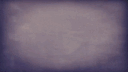 A Cartoon Character With Purple Hair And A Checkered Scarf Is Smiling GIF
