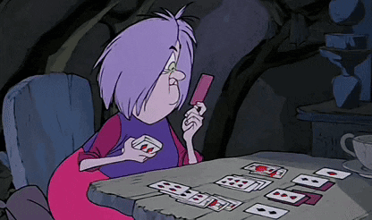 A Cartoon Character With Purple Hair Playing Cards GIF