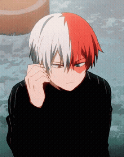 A Cartoon Character With Red And White Hair And A Black Shirt GIF