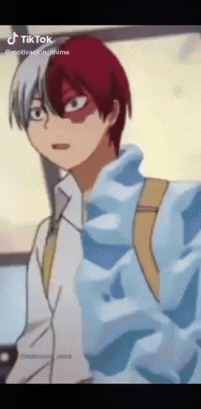 A Cartoon Character With Red And White Hair Is Wearing A Blue Jacket . GIF