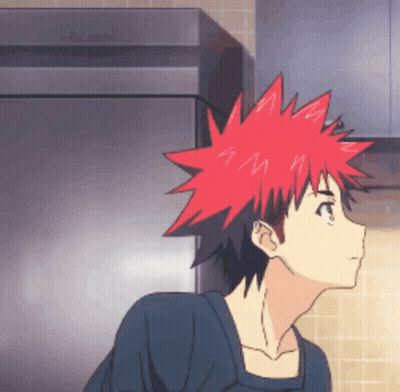 A Cartoon Character With Red Hair And A Black Shirt GIF