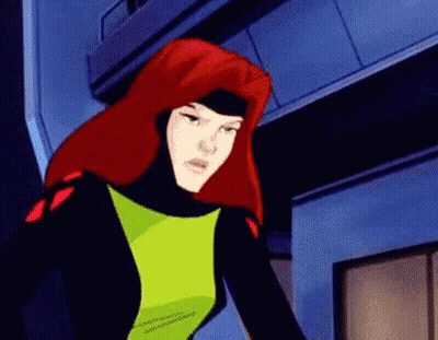 A Cartoon Character With Red Hair And A Green Top GIF