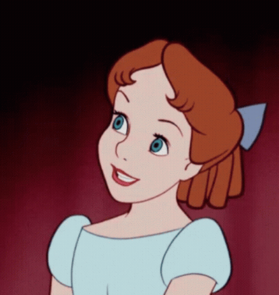 A Cartoon Character With Red Hair And Blue Eyes GIF