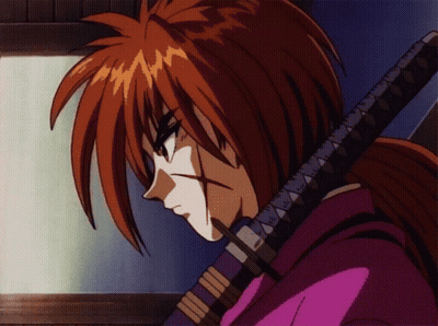 A Cartoon Character With Red Hair Is Holding A Sword In His Right Hand GIF