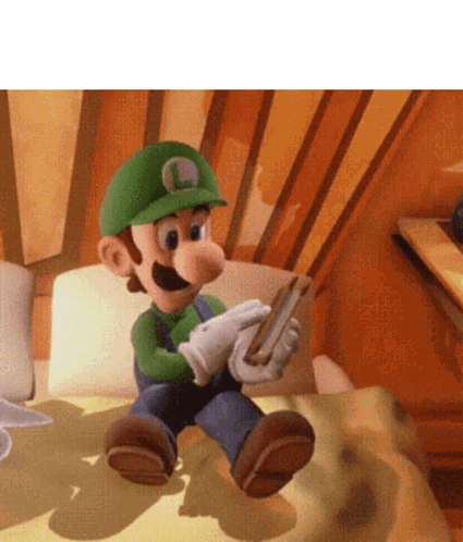 A Cartoon Character With The Letter L On His Hat Is Sitting On A Bed GIF