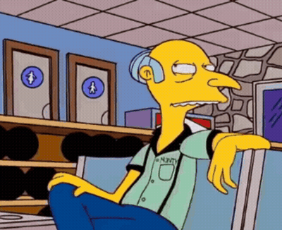 A Cartoon Character With The Name Minty On His Shirt Is Sitting In Front Of A Bowling Alley GIF