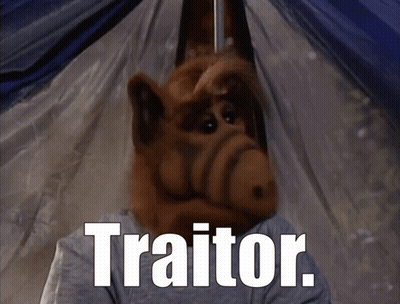 A Cartoon Character With The Word Traitor On The Bottom GIF