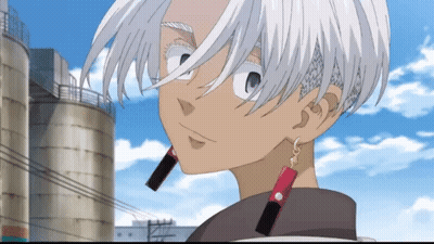 A Cartoon Character With White Hair And Red Earrings Stands In Front Of A Silo GIF